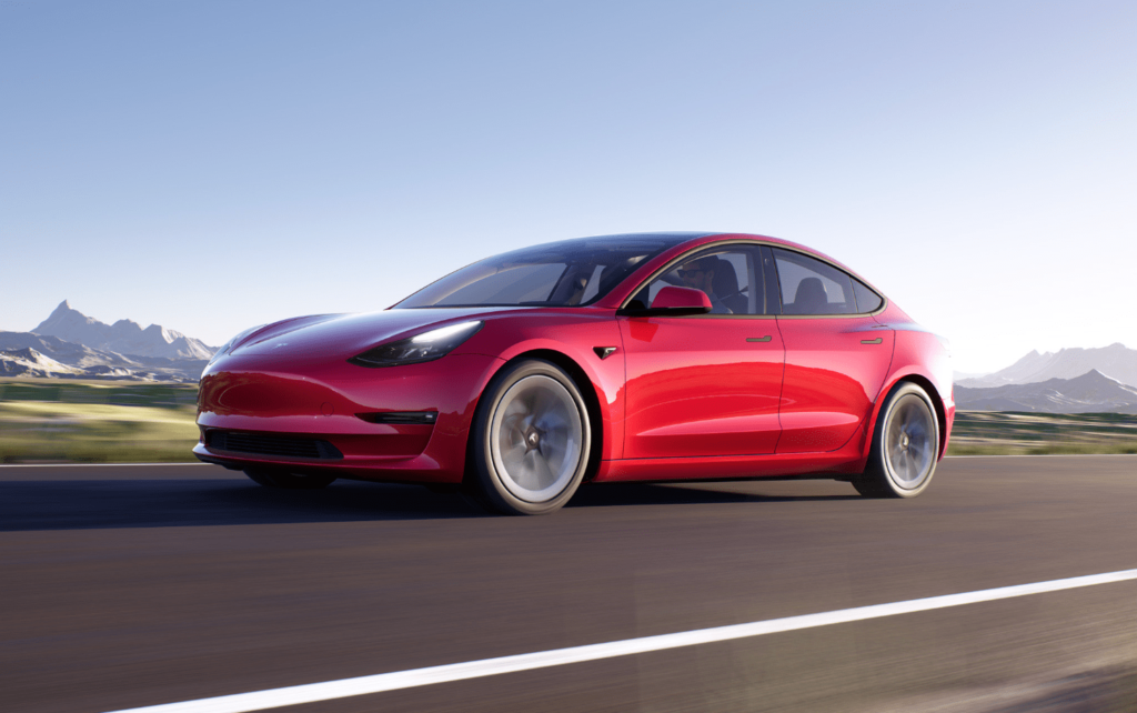 2023 Red Tesla Model 3 on the highway