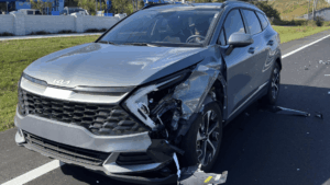 Electric Kia with front-end damage after a collision during repair estimate evaluation