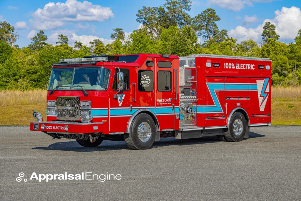The E-One Vector, Mesa's pioneering all-electric fire truck, in bright red with electric blue accents and '100% ELECTRIC' emblazoned on the side.