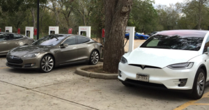 Teslas model s and model x at charging station