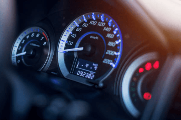 Car dashboard odometer reading 92,382 miles, illustrating how high mileage affects a diminished value claim