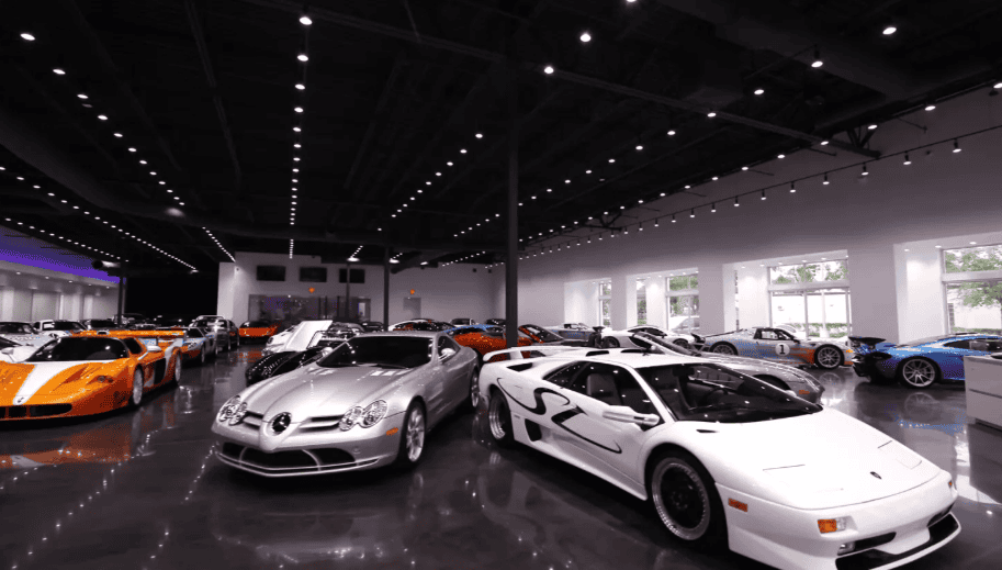 Luxury imported vehicles including Mercedes and Lamborghini on display at a U.S. dealership showroom in 2025